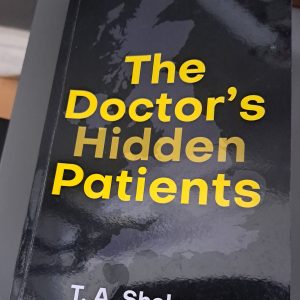 Paperback copy of The Doctor's Hidden Patients by T. A. Shelano.