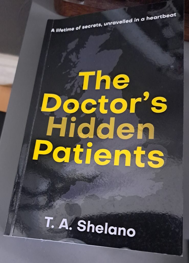 Paperback copy of The Doctor's Hidden Patients by T. A. Shelano.