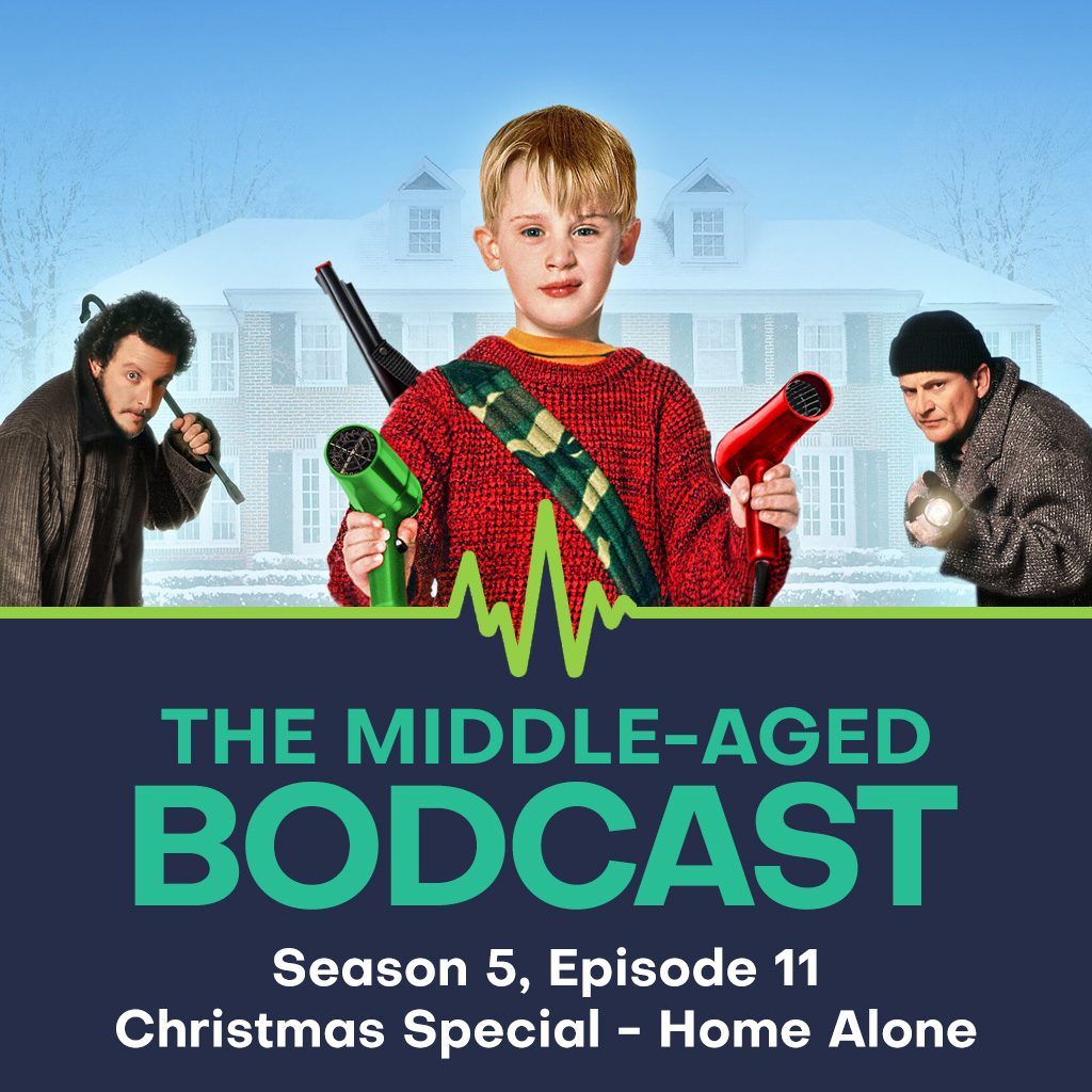 Promotional artwork for The Middle-aged Bodcast's Season 5 Episode 11 Christmas Special on Home Alone. The design features a young Kevin McCallister standing front and centre, holding two hairdryers like weapons, with the McCallister house in snowy blue tones behind him. On either side of Kevin, the two Wet Bandits: Harry and Marv are shown sneaking in from the edges. Below the image is the Bodcast logo and text that reads: "The Middle-aged Bodcast – Season 5, Episode 11, Christmas Special – Home Alone."